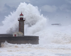 10 Meters Big Waves Over the "Felgueiras" Lighthouse with a Cargo Ship Departing in Oporto, Portugal.