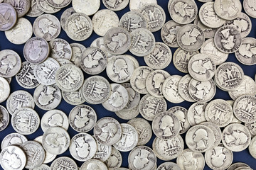 Vintage thirties silver shiny and dull quarters background. Horizontal.