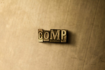COMP - close-up of grungy vintage typeset word on metal backdrop. Royalty free stock illustration.  Can be used for online banner ads and direct mail.