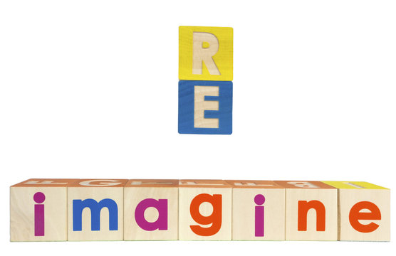 RE IMAGINE concept spelled with toy blocks. isolated.