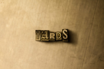 YARDS - close-up of grungy vintage typeset word on metal backdrop. Royalty free stock illustration.  Can be used for online banner ads and direct mail.