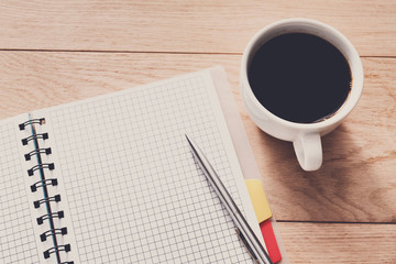 Office supplies, writing checklist concept on wood background