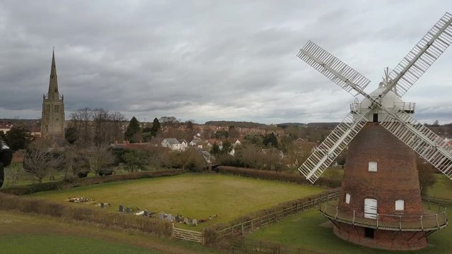 Thaxted village, windmill and parish church, Essex, England. Drone flying in.