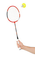 Hand with badminton racket and shuttlecock