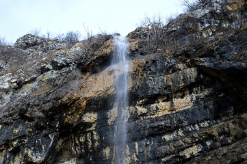 Fototapeta na wymiar Wild natural waterfall cascade