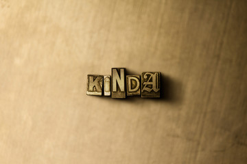 KINDA - close-up of grungy vintage typeset word on metal backdrop. Royalty free stock illustration.  Can be used for online banner ads and direct mail.