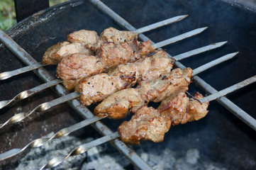 meat grilled over charcoal