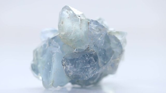 blue stone Celestite (Celestine ) on a white background