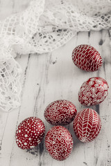 Decorated Easter eggs Pysanka on whitewashed wooden background