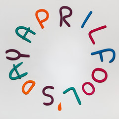 April Fools Day phrase made of plasticine colorful letters on background