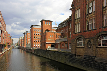 Fototapeta na wymiar Brick building on the Herrengrabenfleet in the Hanseatic City Hamburg, Germany, Europe.