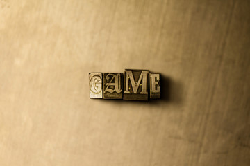 GAME - close-up of grungy vintage typeset word on metal backdrop. Royalty free stock illustration.  Can be used for online banner ads and direct mail.
