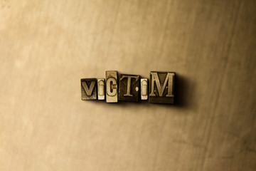 VICTIM - close-up of grungy vintage typeset word on metal backdrop. Royalty free stock illustration.  Can be used for online banner ads and direct mail.