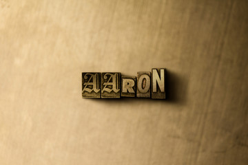 AARON - close-up of grungy vintage typeset word on metal backdrop. Royalty free stock illustration.  Can be used for online banner ads and direct mail.