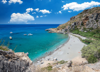 Fototapeta premium Preveli Beach in Crete island, Greece. There is a palm forest and a river inside the gorge near this beach.