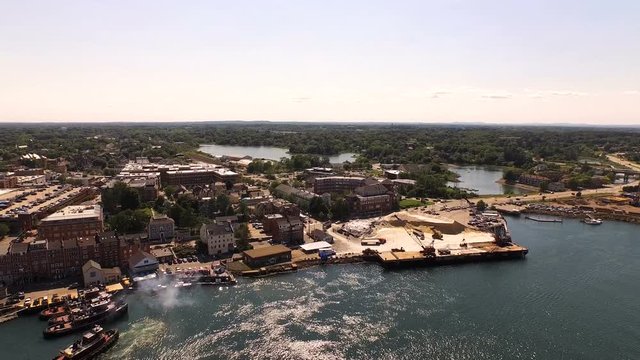 Portsmouth Aerial v8 Flying low over Piscataqua River and harbor panning with city views.