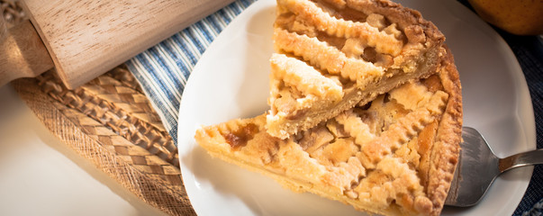 home made apple tart on a white plate