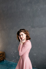Obraz premium the beautiful girl in a pink dress