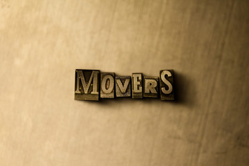 MOVERS - close-up of grungy vintage typeset word on metal backdrop. Royalty free stock illustration.  Can be used for online banner ads and direct mail.