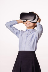 schoolgirl with virtual reality headset. Innovation technology and education concept