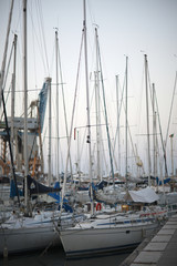 Sailboats docked at the piers in the Mediterranean portu.Sitsiliya, Italy.