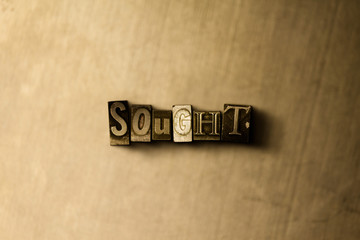 SOUGHT - close-up of grungy vintage typeset word on metal backdrop. Royalty free stock illustration.  Can be used for online banner ads and direct mail.