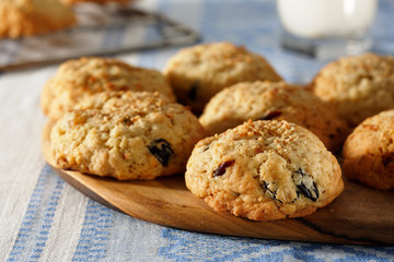 Homemade biscuit with a cup of milk, close view.