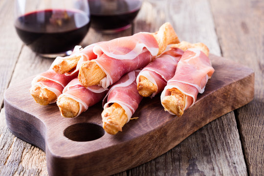 Puff pastry cheese sticks with cured ham