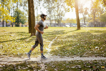 Young Man Running At The Park