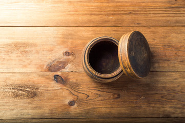 Blank wooden bowl on table background, top view