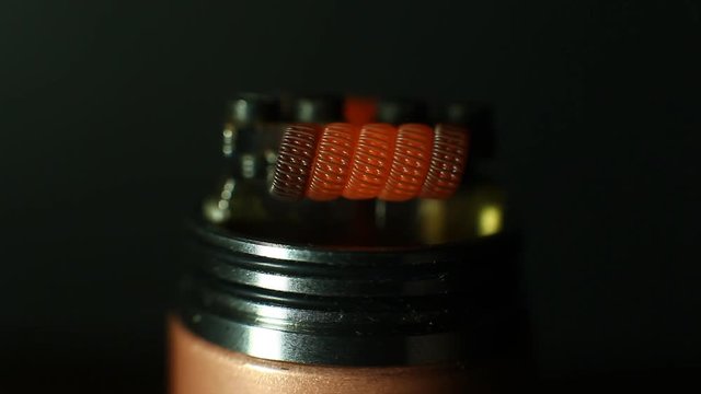 Burning triple staggered fused clapton coil in rebuildable dripping atomizer