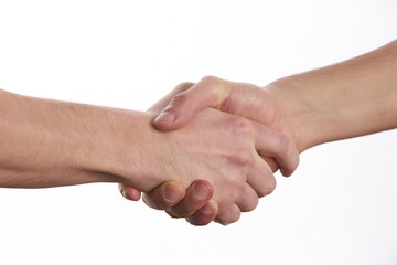 Closeup image of a Business handshake. Business handshake and business people concept. Two men shaking hands over isolated white background. Partnership, Deal.