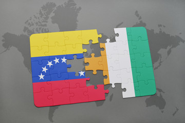 puzzle with the national flag of venezuela and cote divoire on a world map