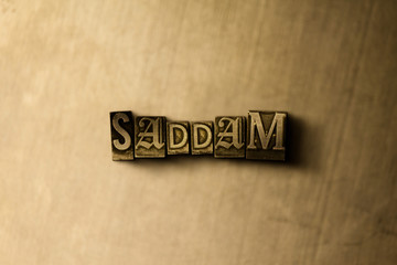 SADDAM - close-up of grungy vintage typeset word on metal backdrop. Royalty free stock illustration.  Can be used for online banner ads and direct mail.