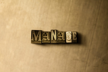 MANAGE - close-up of grungy vintage typeset word on metal backdrop. Royalty free stock illustration.  Can be used for online banner ads and direct mail.