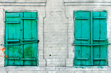 Fototapeta na wymiar retro window with wooden shutters and stone walls