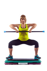 Fitness woman is exercising with the crossbar. Isolated on white background.