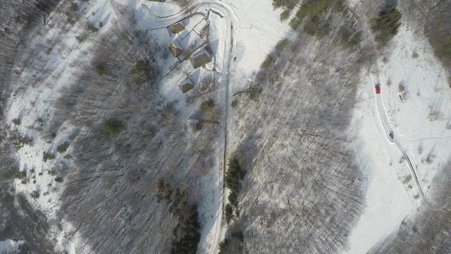 Traditional Ukrainian village in winter, Pirogovo architecture museum, aerial view, raw, 4K