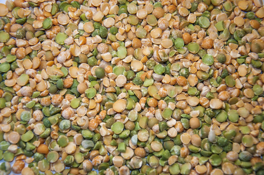 Foodstuff: mixture of dry peas on white background.