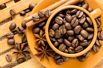 coffee beans in Cup on a wooden background