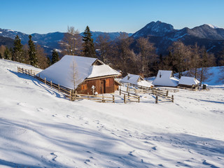Traditional cottages on Velika planina in winter, Slovenia