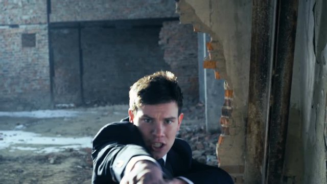 Businessman showing movements of martial arts. 4k