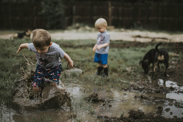 Children playing on muddy field