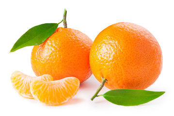 tangerines or clementines with green leafs and slices isolated on white background