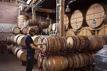 Brewer sampling beer at the brewery