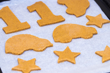 Making homemade christmas cookies in various shapes