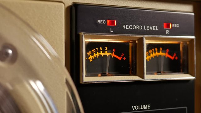Analog vu meter of a vintage tape recorder machine while recording
