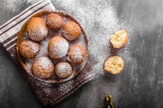 Homemade donuts with sugar and gun