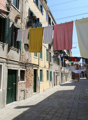 Fototapeta na wymiar Venice Italy so many clothes hanging in the street called Calle