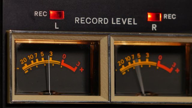 Analog vu meter of a vintage tape recorder machine while recording